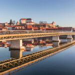 Modern bridge structure and its reflection in old town Ptuj, Slo