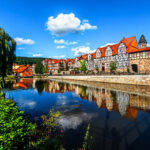 View of the old town Hannoversch Munden with medieval half-timbered houses across Werra river. Germany, Lower Saxony.